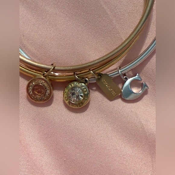 Coach 3 bangle bracelets 2 gold plated and 1 silver 
All have dangly charms - Picture 5 of 5